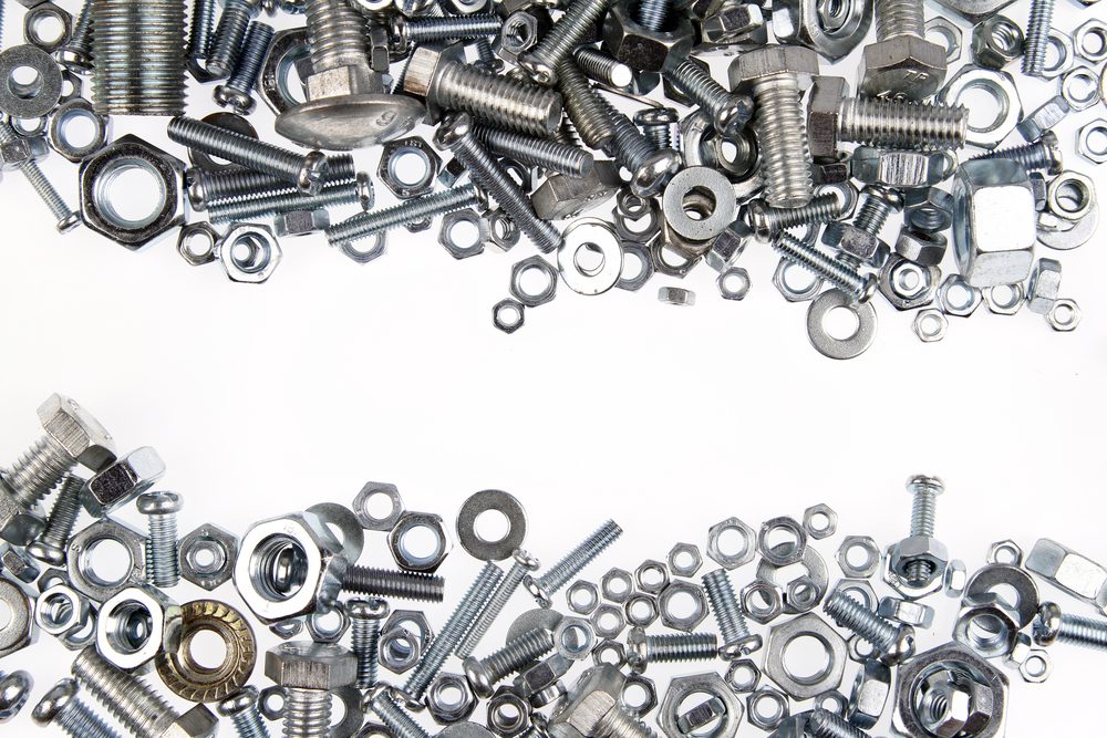 chrome,nuts,and,bolts,closeup,on,plain,background